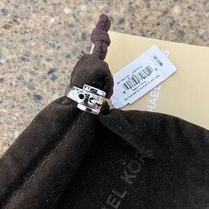 NWT Michael Kors silver plated buckle ring.